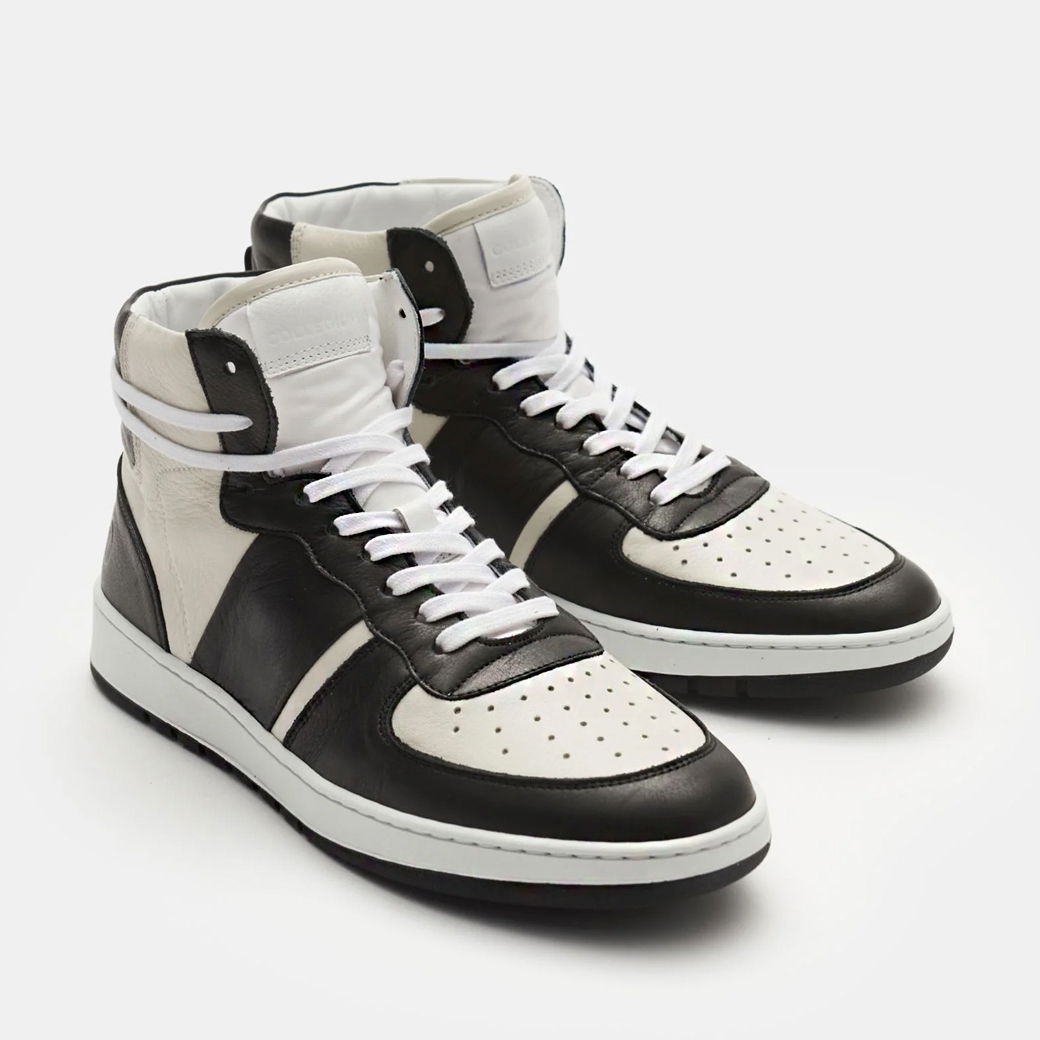 Freistehende Herren High-Top Sneaker in Schwarz-Weiß aus Leder mit weißen Schnürsenkeln und perforierter Zehenkappe. Freistehende Herren High-Top Sneaker in Schwarz-Weiß aus Leder mit weißen Schnürsenkeln und perforierter Zehenkappe.