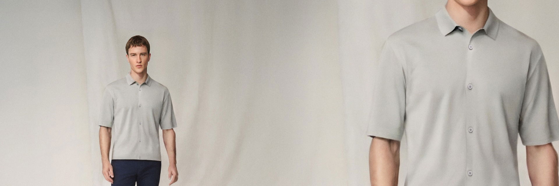Mann trägt hellgraues Kurzarmhemd mit Knöpfen, steht vor hellem Hintergrund, Nahaufnahme zeigt Details des Hemdes. Mann trägt hellgraues Kurzarmhemd mit Knöpfen, steht vor hellem Hintergrund, Nahaufnahme zeigt Details des Hemdes.