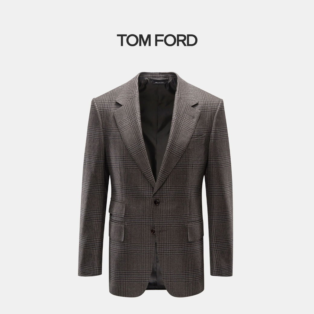 Dunkelgraues Tom Ford Sakko mit Glencheck-Muster, zwei Knöpfen, fallendem Revers und zwei Pattentaschen, ohne Innenfutter sichtbar.