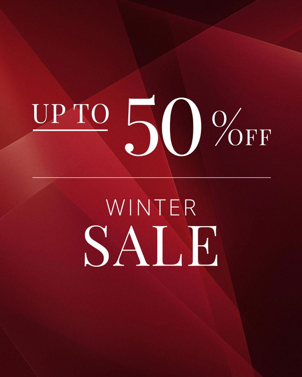Red geometric background with white text stating 'Up to 50% off Winter Sale' in elegant fonts.