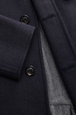 Close-up front view of the Circolo 1901 Wollmantel graublau showing the fine navy wool fabric, hidden button placket, and soft grey herringbone lining.