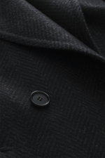 Close-up front view of the Cesare Attolini Cashmere Coat dark grey patterned, showing soft cashmere wool, button, and peak lapel details.
