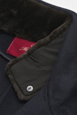 Close-up top-down view of the stand-up collar and interior of the Montecore Cashmere Coat navy, made of pure cashmere with soft touch and removable beaver fur trim.