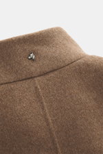 Close-up rear view of Montecore Cashmere Coat taupe collar, made of pure cashmere with a soft touch and silver dog head pin, elegant and slim fit with four-button style and removable beaver fur trim.