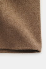 Close-up front view of the Montecore Cashmere Coat taupe fabric showing its pure cashmere soft touch texture and slim fit design.