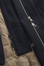 Close-up front view of the Montecore Down short coat dark navy showing the zipper, button, and beige quilted microfiber lining.

Description: <p>This exclusive short coat from MONTECORE made of fine virgin wool with a removable double front and warming do