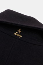Close-up view of the collar and gold logo detail on the Sealup Pea coat 'Maestrale' navy, made of fine wool-cashmere blend.