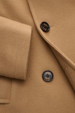 Close-up front view of Sealup Short pea coat 'Genova' camel showing soft wool-cashmere fabric, buttons, wide lapel, and sleeve cuff.