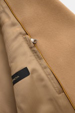 Close-up inside view of Sealup Short pea coat 'Genova' camel showing smooth lining, zipped inside pocket, and wool-cashmere fabric edge.