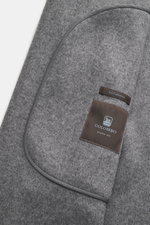 Close-up of Colombo Kid Cashmere fleece coat grey/taupe melange from above showing pure cashmere fabric, velour leather details, and label.