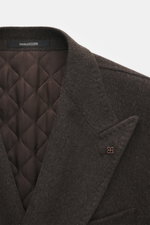 Close-up front view of Tagliatore Wool Coat Dark Grey Melange showcasing peaked lapel with pin and quilted lining fabric.

Description: <p>TAGLIATORE's signature understated elegance is expressed through this impeccably tailored double-breasted coat. Craf