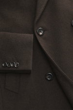 Close-up front view of Luigi Bianchi Wool coat dark brown melange showcasing buttons, peak lapel, and sleeve cuff details. Italian craftsmanship combined in exclusive men's fashion – LUIGI BIANCHI excels at this and presents a true classic for the confide