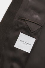 Close-up interior view of Luigi Bianchi Wool coat dark brown melange showing smooth lining, inside pocket, and fabric texture from above. Italian craftsmanship combined in exclusive men's fashion – LUIGI BIANCHI excels at this and presents a true classic 