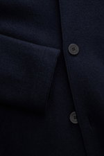 Close-up front view of the Lunaria Cashmere Cashmere short coat navy showing textured pure cashmere fabric, four-button style, and flap pocket detail. Timeless elegance, masterfully staged: The exclusive short coat from LUNARIA CASHMERE combines a clear, 