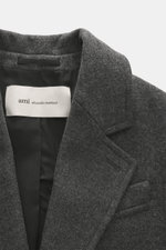 Close-up front view of Ami Paris Wool coat dark grey melange featuring pure new wool, textured quality, oversized fit, two-button placket, notched lapel, classic breast pocket, slanted welt pockets, sleeve cuffs with buttons, center back vent, smooth lini