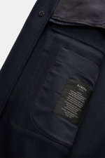 Close-up inside view of the Barena Venezia Coat navy showing soft wool blend fabric, inside pocket with label, and button detail.