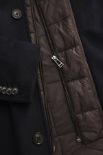 Close-up front view of Windsor Short coat 'Rivano' navy showing soft wool, cashmere, microfiber blend with smooth lining, four-button placket, zipper chest pocket, sleeve cuffs with kissing buttons, and removable double front with faux fur trim and hood.