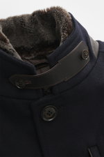 Close-up front and top view of the Windsor Short coat 'Rivano' navy, featuring a mix of wool, cashmere, and microfiber, soft feel, slim fit, four-button placket, removable double front with faux fur trim and hood, stand-up collar with button tab, zipper c