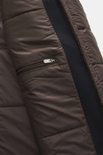 Close-up interior view of the Windsor Short coat 'Rivano' navy showing smooth lining fabric with zipper chest pocket, made of a mix of wool, cashmere, and microfiber, soft feel, slim fit, four-button placket, removable double front with faux fur trim and 