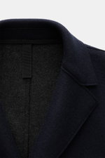 Close-up front top view of Harris Wharf London Wool coat navy showing felted virgin wool with cashmere, lapel, and clean lines.

Description: 
<p>A timeless look for the new season: This coat with a straight silhouette from HARRIS WHARF LONDON, made of fe