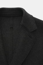 Close-up front view of Harris Wharf London Wool coat dark grey melange collar and felted wool texture, showing artisanal quality and raw-edge finish.