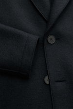 Close-up front view of the Harris Wharf London Wool coat navy, showcasing the pure felted virgin wool fabric, three-button placket, notch collar, and sleeve detail, highlighting its heavy, tactile quality and modern artisanal finish.