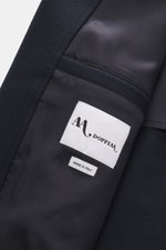 Close-up interior view of the Doppiaa Coat 'Aaladin' navy showing the wool blend fabric and labels, highlighting soft touch and craftsmanship.