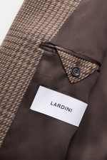 Close-up inside view of Lardini Coat brown/beige checkered showing soft virgin wool and cashmere blend, check weave, smooth lining, and button details.