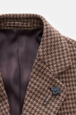 Close-up front view of Lardini Coat brown/beige pattern showing notch collar with flower pin, mix of virgin wool and cashmere, soft feel, houndstooth weave pattern, regular fit, three-button placket, slanted welt pockets, center back vent, smooth lining f