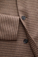 Close-up front view of Lardini Coat brown/beige pattern showing soft virgin wool and cashmere fabric with houndstooth weave, regular fit, three-button placket, notch collar with flower pin, slanted welt pockets; smooth lining fabric, center back vent, and