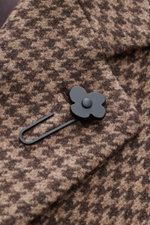 Close-up front view of Lardini Coat brown/beige pattern fabric showing houndstooth weave, soft mix of virgin wool and cashmere, notch collar with flower pin. Regular fit, three-button placket, slanted welt pockets, center back vent, smooth lining fabric, 