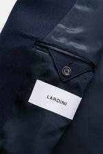 Close-up inside view of the Lardini Wool Coat Navy showing light virgin wool fabric, soft feel, smooth lining, button, and label details.