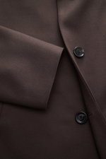 Close-up front angle of Lardini Wool Coat dark brown showing light fabric made of pure virgin wool, soft feel, regular fit, three-button placket, notch collar with flower pin, slanted welt pockets, center back vent, smooth lining fabric, and two inside po