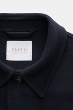 Close-up front view of the navy 04651/ A trip in a bag Coat 'Double Coat' featuring a mix of virgin wool and microfiber, soft touch, slim fit, turn-down collar, five-button placket, and slanted welt pockets.