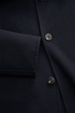 Close-up front view of the navy 04651/ A trip in a bag Coat 'Double Coat' showcasing mix of virgin wool and microfiber, soft touch, slim fit, turn-down collar, five-button placket, and slanted welt pockets.