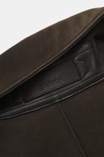 Close-up front view of the collar and label of the Brioni Dark Brown Sherling Coat, showcasing noble suede leather and detailed stitching.

Additional description: <p>This winter, you can shine with this noble suede leather coat by BRIONI, which also keep