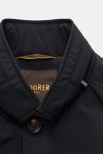 Close-up front view of the Moorer Kurzmantel 'Hektor' navy showcasing its smooth, high-quality microfiber fabric, standing collar with hidden hood, four-button placket, and detailed stitching.