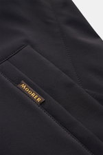 Close-up angled view of the navy Moorer Kurzmantel 'Hektor' pocket, showing smooth, high-quality microfiber fabric, neat stitching, and a small brown Moorer label. The water-repellent material and slim fit design are highlighted in this detailed shot. <ar