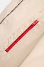 Close-up view of the Fay Coat 'Morning' sand showing the cotton twill fabric, red zip double front, and concealed button placket details.