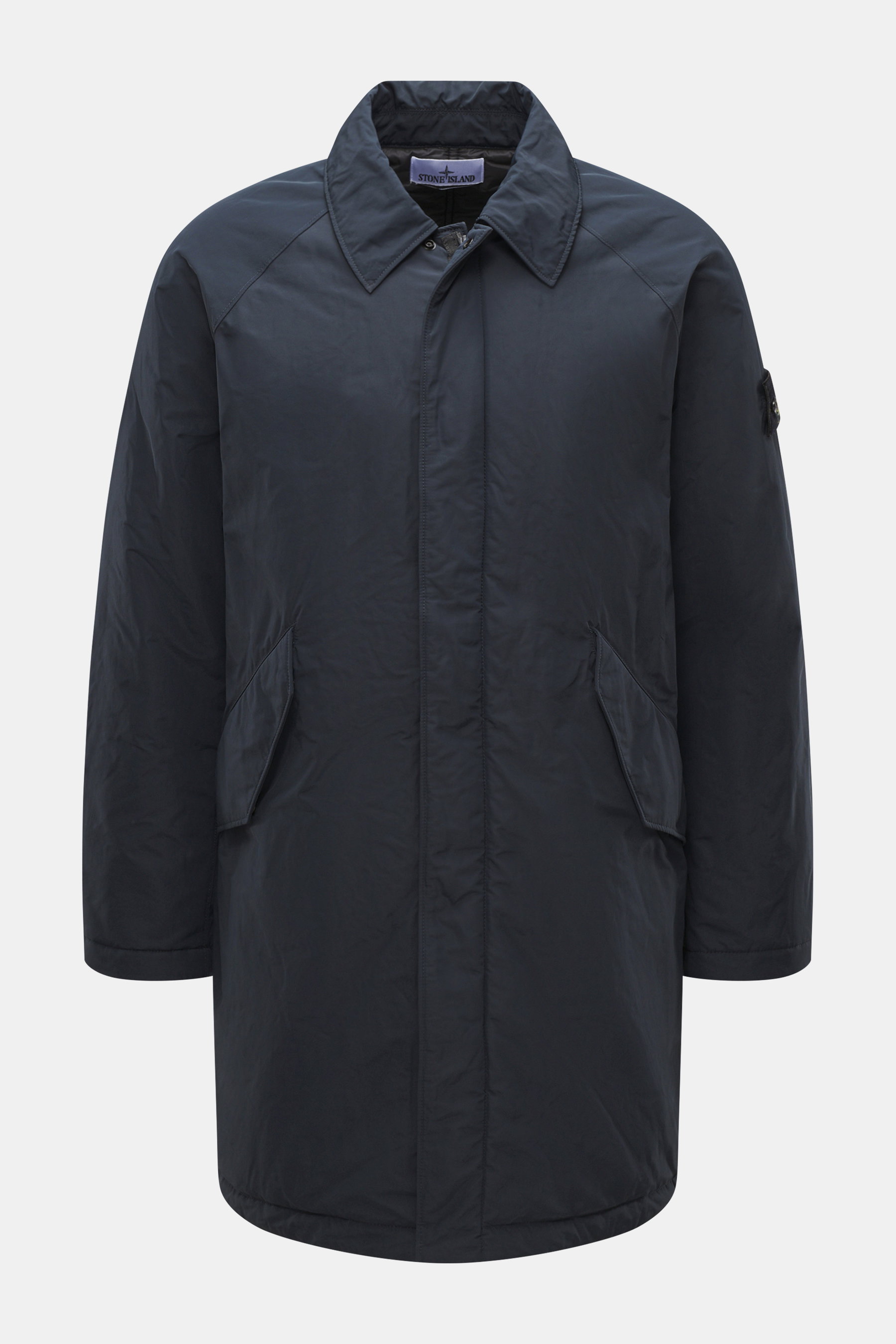 Front view of Stone Island Short Coat 'Micro Reps' navy made of high-quality microfiber with smooth touch, wind and water repellent, warm Primaloft filling, Slim Fit, two-way zipper, wind flap with buttons, turn-down collar, raglan sleeves, large front po