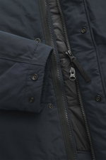 Close-up view of the Stone Island Short Coat 'Micro Reps' navy, showing high-quality microfiber, smooth touch fabric, two-way zipper, wind flap with buttons, and quilted lining fabric.
