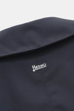 Close-up from above of the turn-down collar with strap on the Herno Down short coat dark blue, made of high-quality microfiber with smooth feel, wind- and water-repellent, light down filling, regular fit, concealed button placket, slanted hip pockets with