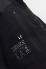 Close-up front view of the black UBR Down coat 'Tycoon' showing a waterproof zip pocket and printed technical features. With the 'Tycoon' down coat, you are guaranteed to stay dry and warm throughout the colder seasons, because high-tech materials and inn