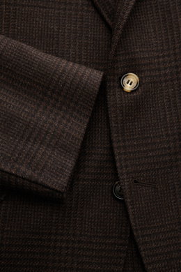 Close-up front view of the Brunello Cucinelli Suit black/brown checked showing fine glen check pattern, buttons, and wool-cashmere-silk fabric texture.
