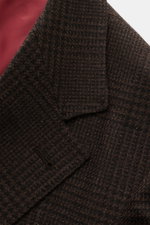 Brunello Cucinelli Suit black/brown checked close-up from above showing soft wool-cashmere-silk blend fabric and fine glen check pattern.