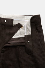 Brunello Cucinelli Suit black/brown checked trousers shown from a close-up top-front angle with zipper open, revealing fine wool, cashmere, silk blend.