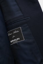 Close-up inside view of Cesare Attolini Anzug dark navy showcasing fine Super 150'S wool lining and label, highlighting Neapolitan tailoring.