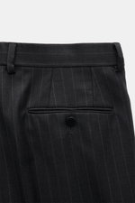Close-up front view of Stile Latino Anzug 'Vincenzo' anthrazit gestreift slim fit trousers made of fine pure wool twill with pinstripes, button fly, belt loops, French pockets, small watch pocket, and buttoned back pocket.

(Note: The alt tag is 124 chara