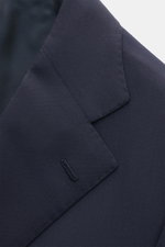 Close-up front-angle view of Cesare Attolini Suit navy lapel, showcasing pure Super 150'S wool knit, slim fit, and flawless Neapolitan tailoring craftsmanship.