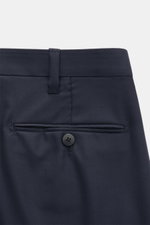 Close-up rear view of the Cesare Attolini Suit navy trousers, showcasing the jetted back pocket with button, belt loop, and smooth Super 150'S wool fabric. Neapolitan tailoring in perfection: Made of fine knit Super 150'S wool, this suit by CESARE ATTOLIN